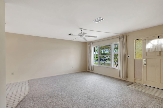 interior space with visible vents and a ceiling fan