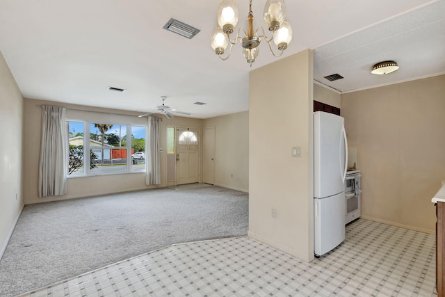 kitchen featuring light colored carpet, freestanding refrigerator, visible vents, and baseboards