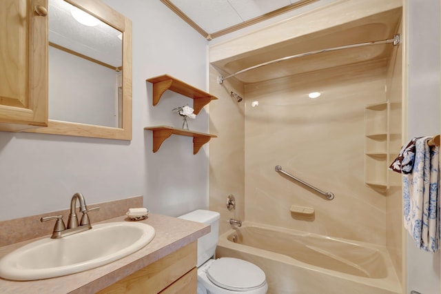 full bathroom featuring toilet, bathtub / shower combination, ornamental molding, and vanity