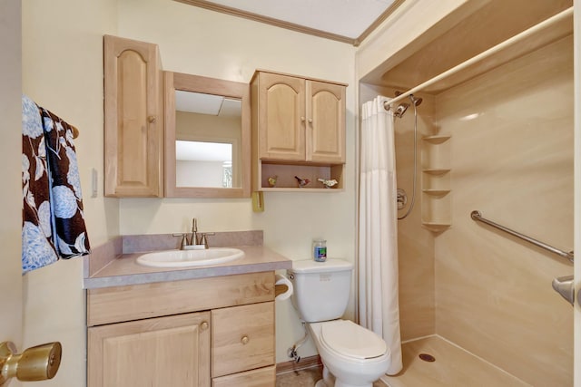 bathroom with ornamental molding, vanity, toilet, and a shower with curtain