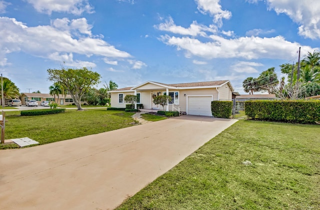 ranch-style house featuring a front lawn, driveway, and an attached garage