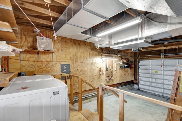 interior space with washer / dryer and wooden walls