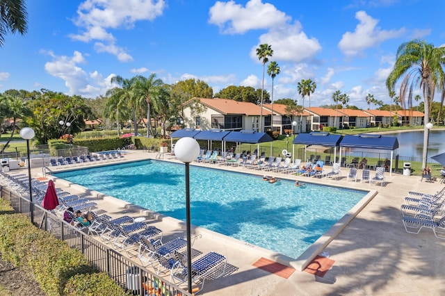 pool featuring a patio area and fence