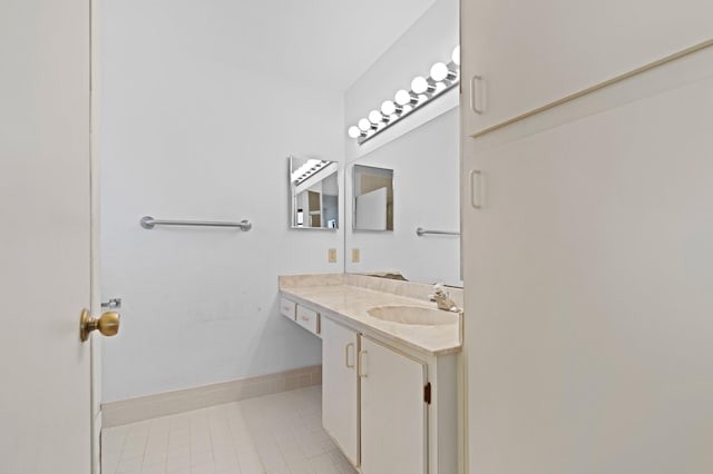 bathroom with vanity and tile patterned flooring