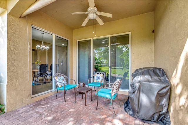 view of patio / terrace with ceiling fan and a grill