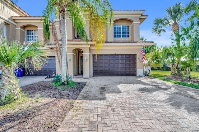 mediterranean / spanish-style house featuring a garage