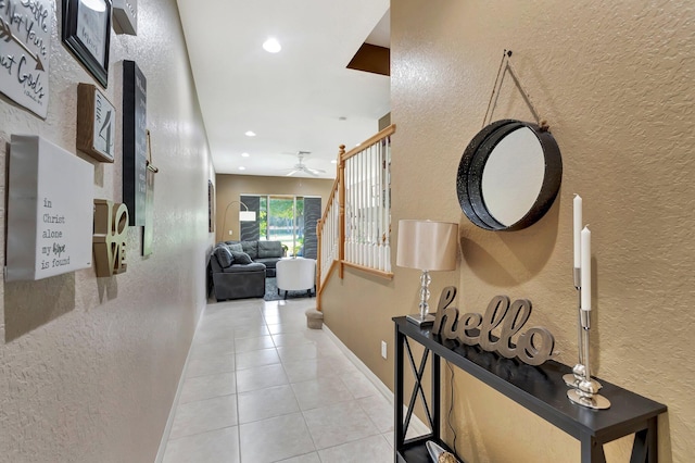 hall featuring light tile patterned flooring