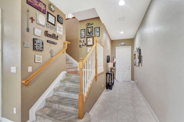 stairs featuring tile patterned floors