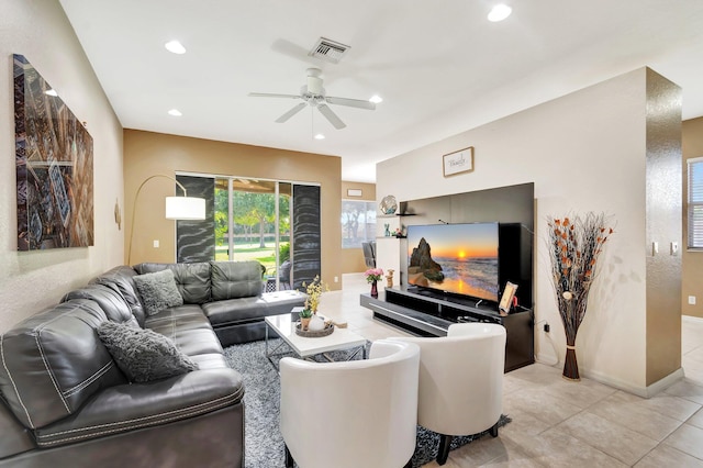 living room featuring ceiling fan and light tile patterned floors