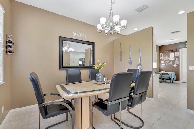 tiled dining area with a notable chandelier