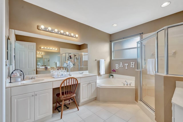 bathroom featuring shower with separate bathtub, tile patterned floors, and vanity