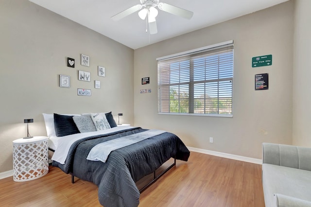 bedroom with wood-type flooring and ceiling fan