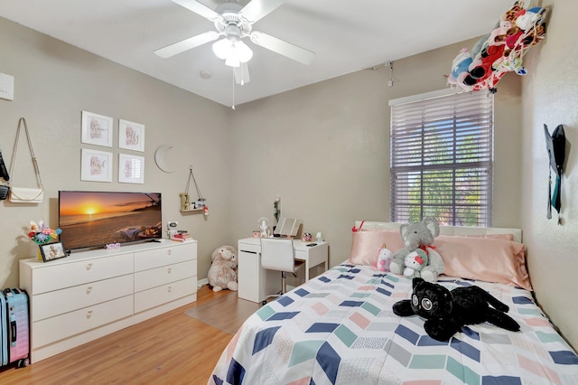 bedroom featuring hardwood / wood-style flooring and ceiling fan