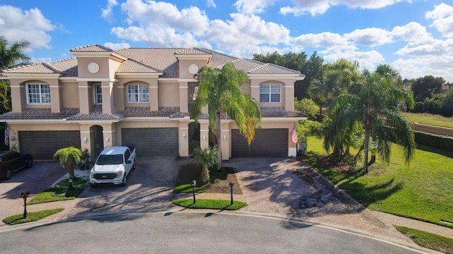 mediterranean / spanish-style home featuring a garage