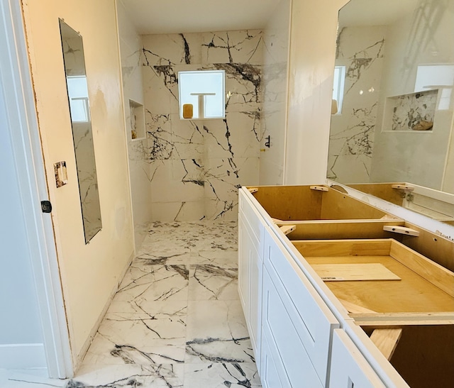 bathroom with a tile shower