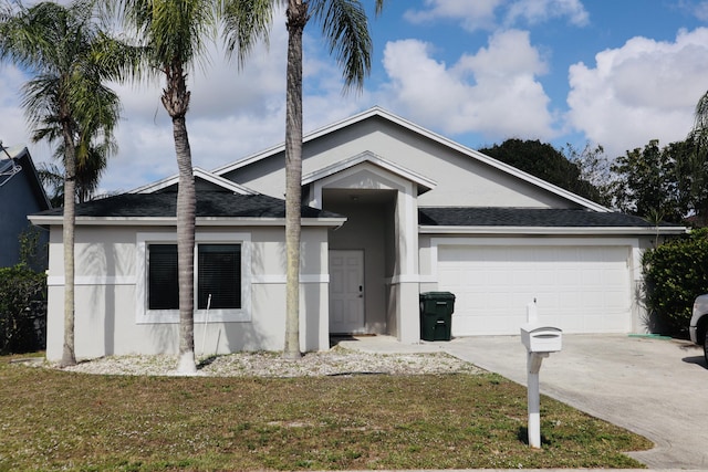 ranch-style home with a garage and a front lawn