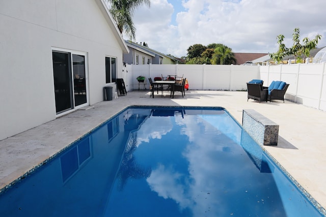 1001 Cape Cod Ter, Greenacres, FL 33413 - view of swimming pool featuring a patio, a fenced backyard, and outdoor dining area
