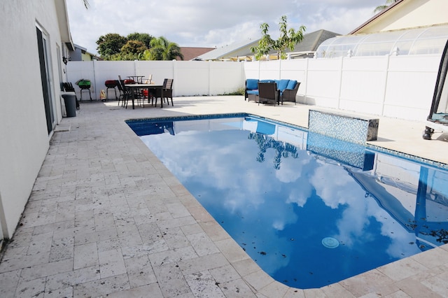 view of swimming pool featuring a patio