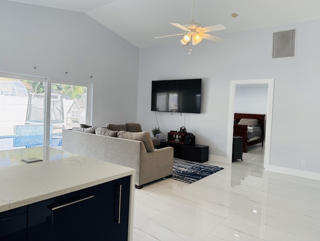 living room with high vaulted ceiling and ceiling fan