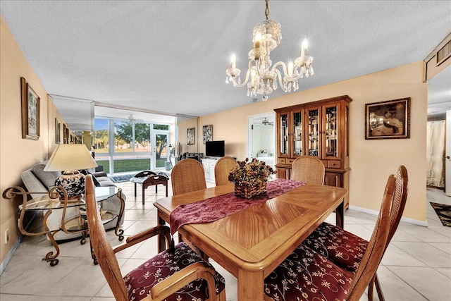 dining room with light tile patterned flooring, floor to ceiling windows, an inviting chandelier, and a textured ceiling