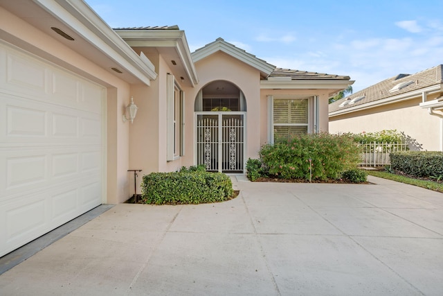 doorway to property featuring a garage