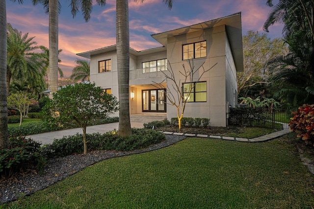 view of front of house with a yard