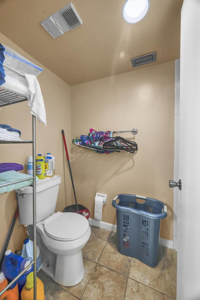 bathroom featuring tile patterned floors and toilet