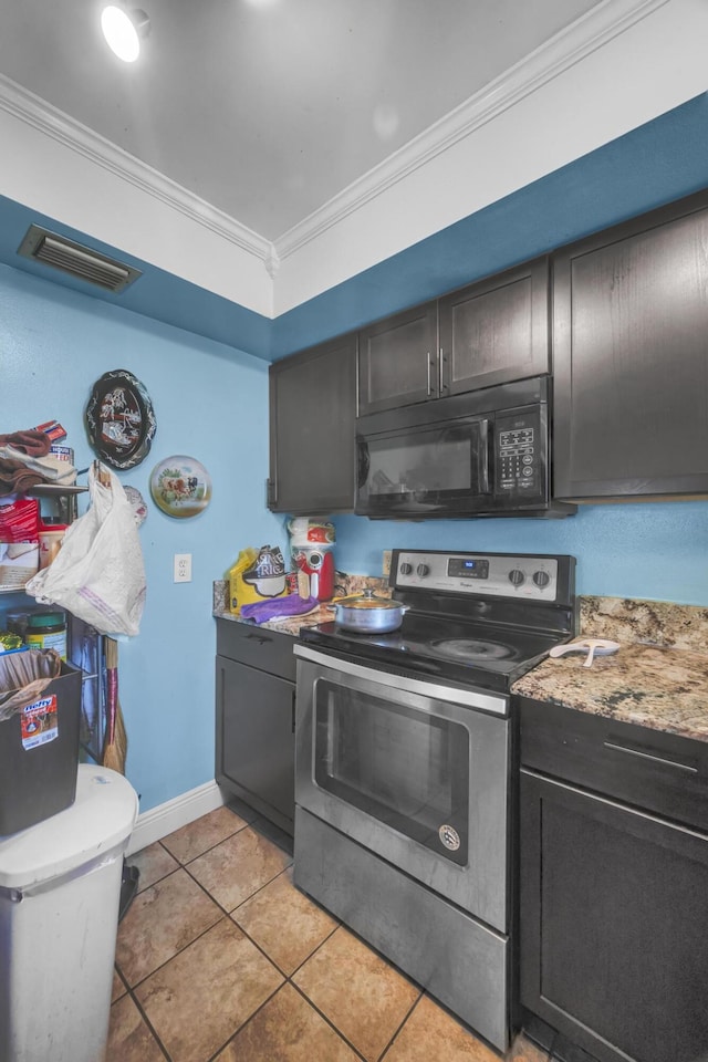 kitchen featuring light tile patterned flooring, ornamental molding, light stone countertops, dark brown cabinets, and electric stove