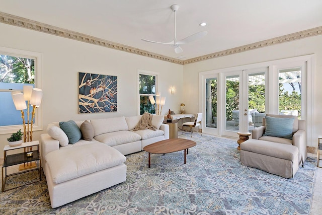 living room with a healthy amount of sunlight, ceiling fan, and french doors