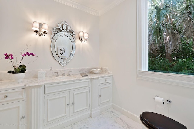 bathroom featuring crown molding and vanity