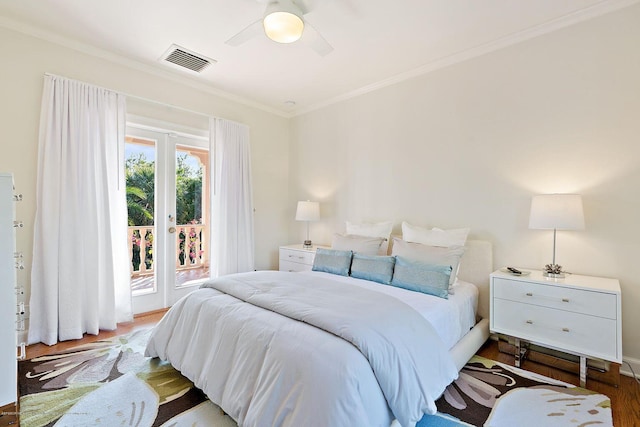 bedroom featuring crown molding, ceiling fan, access to exterior, and dark hardwood / wood-style flooring