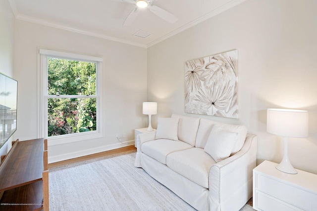 living room featuring crown molding, ceiling fan, and hardwood / wood-style flooring