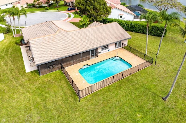 view of swimming pool featuring a patio area and a lawn