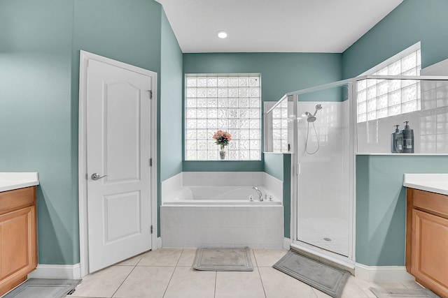 full bathroom with plenty of natural light, vanity, and a shower stall