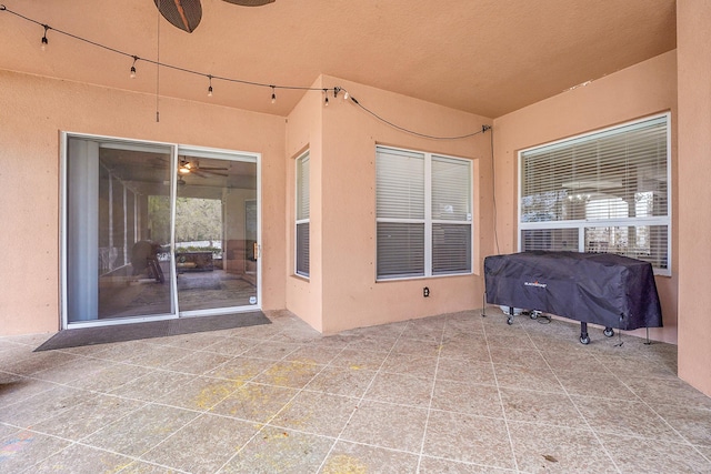 view of patio featuring ceiling fan and grilling area