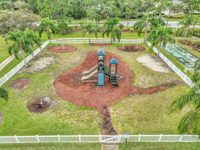 view of yard with fence and playground community