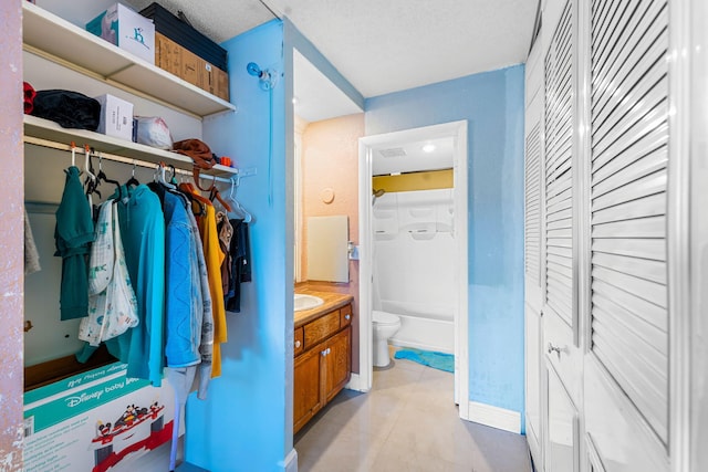 interior space featuring sink and light tile patterned floors