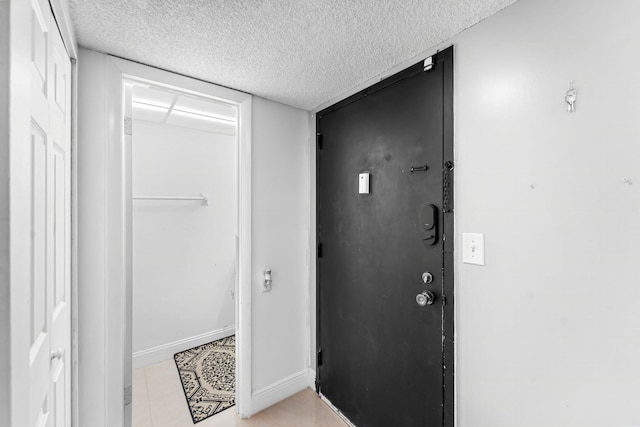 interior space featuring a textured ceiling