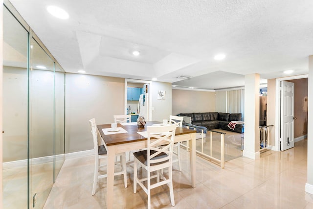 dining space with a textured ceiling