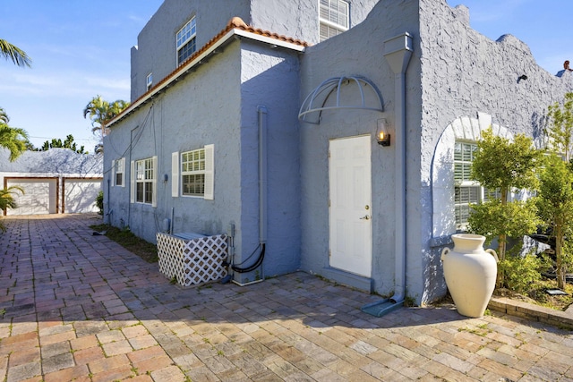 back of house with a patio