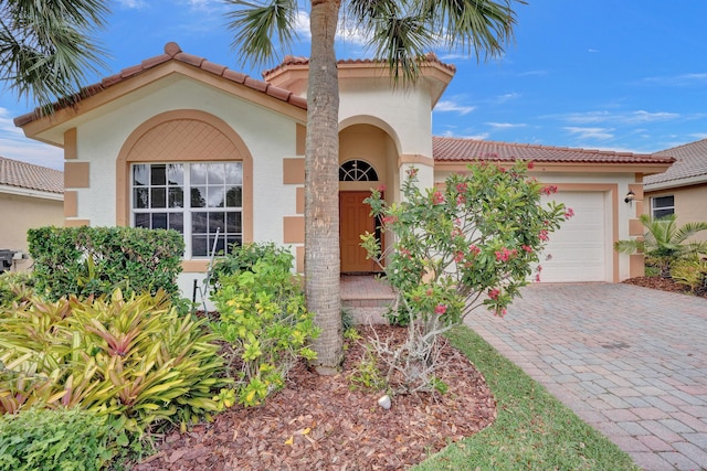 mediterranean / spanish-style house featuring a garage