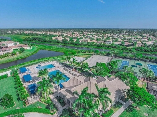 birds eye view of property with a water view