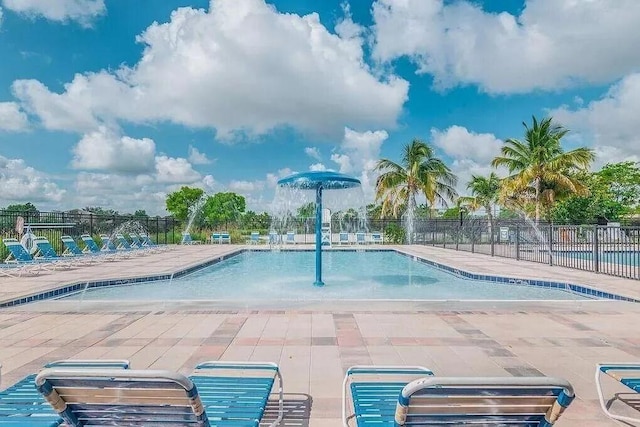 view of swimming pool featuring a patio area