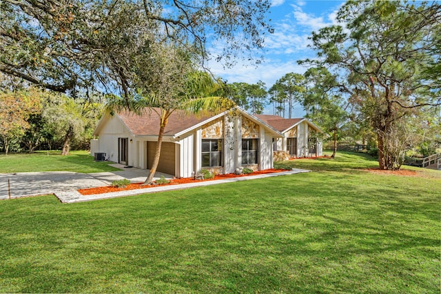 ranch-style house with a garage and a front lawn