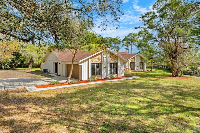 ranch-style home featuring a garage and a front yard