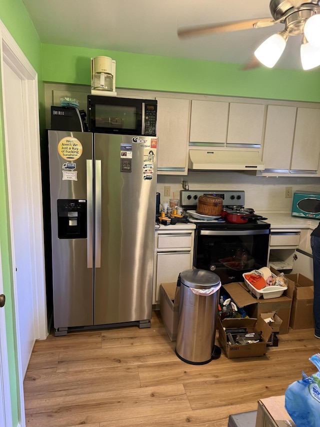 kitchen with white cabinetry, appliances with stainless steel finishes, ceiling fan, and light hardwood / wood-style floors