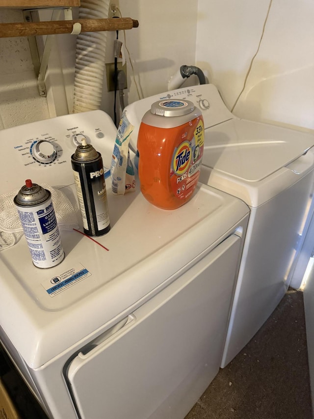 room details featuring washing machine and clothes dryer