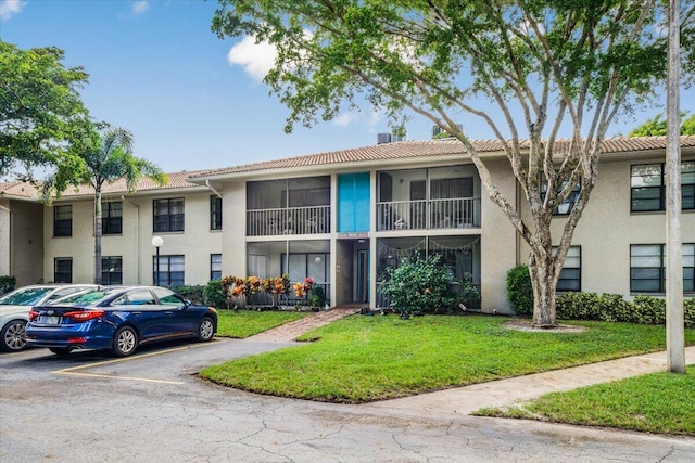 view of property with uncovered parking