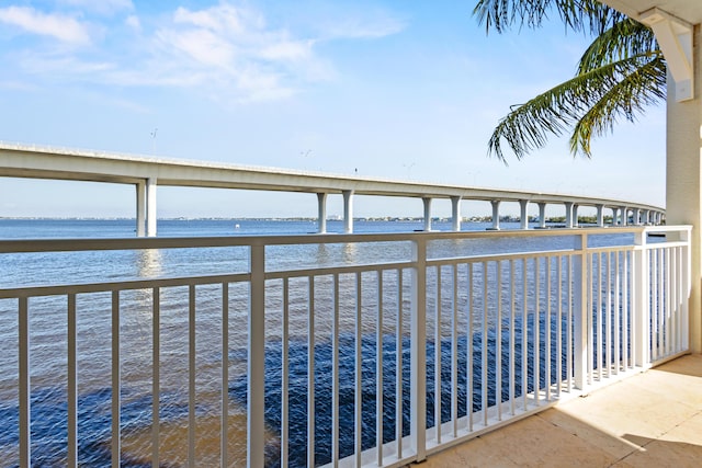 balcony featuring a water view