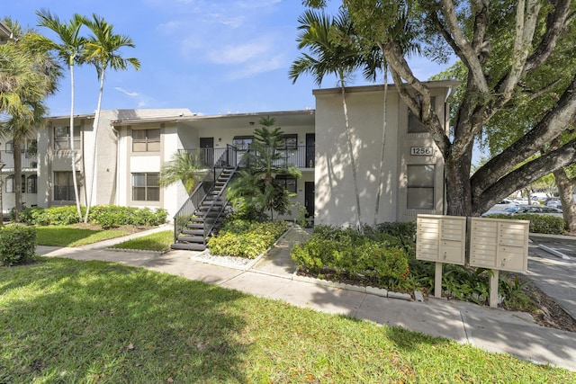 view of property featuring stairway